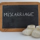 Miscarriage written on blackboard